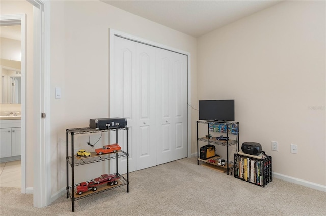 155 Redbud Rd, Palm Coast, FL 32137 - playroom with light carpet, baseboards, and a sink