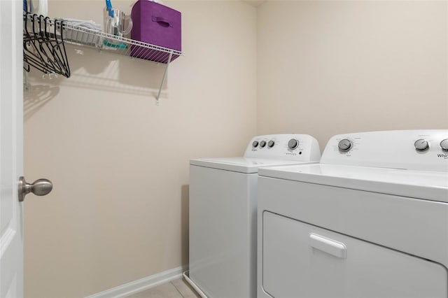 155 Redbud Rd, Palm Coast, FL 32137 - clothes washing area with independent washer and dryer, light tile patterned flooring, and baseboards