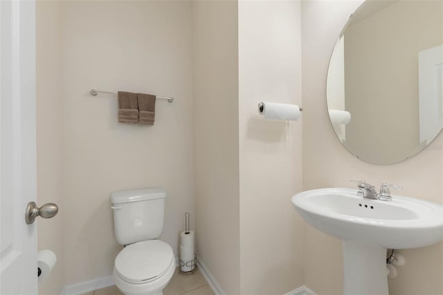 155 Redbud Rd, Palm Coast, FL 32137 - half bathroom with toilet, tile patterned floors, and baseboards
