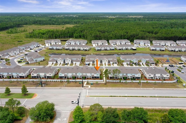 155 Redbud Rd, Palm Coast, FL 32137 - aerial perspective of suburban area with a heavily wooded area