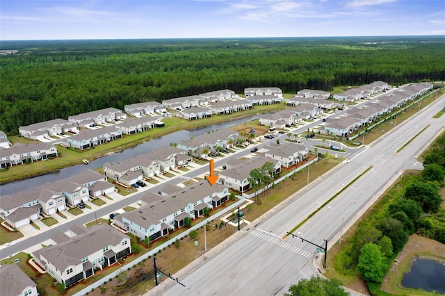 155 Redbud Rd, Palm Coast, FL 32137 - aerial view of residential area featuring a heavily wooded area and a large body of water