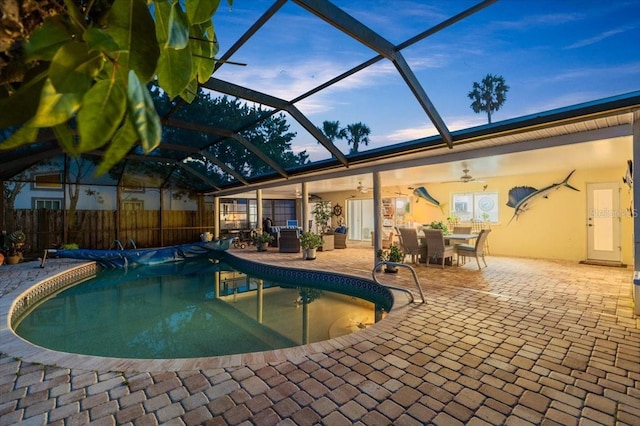 940 Lambert Ave, Flagler Beach, FL 32136 - view of swimming pool with ceiling fan, a patio area, outdoor dining area, glass enclosure, and fence