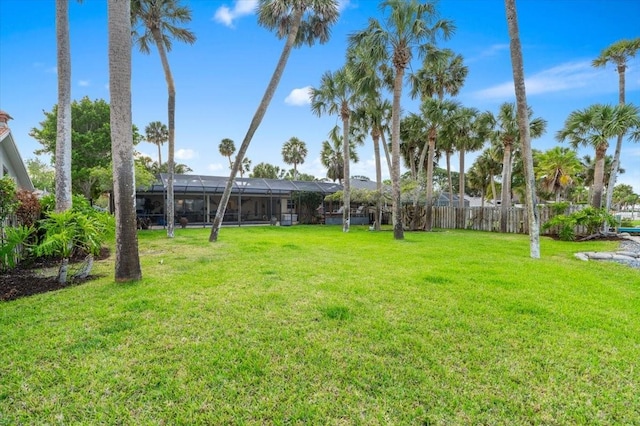 940 Lambert Ave, Flagler Beach, FL 32136 - view of grassy yard featuring a lanai