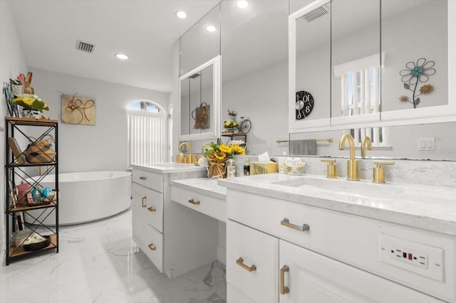 940 Lambert Ave, Flagler Beach, FL 32136 - bathroom with recessed lighting, vanity, a freestanding tub, and marble finish floors