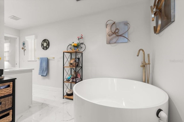 940 Lambert Ave, Flagler Beach, FL 32136 - full bath with a soaking tub, marble finish floors, and vanity