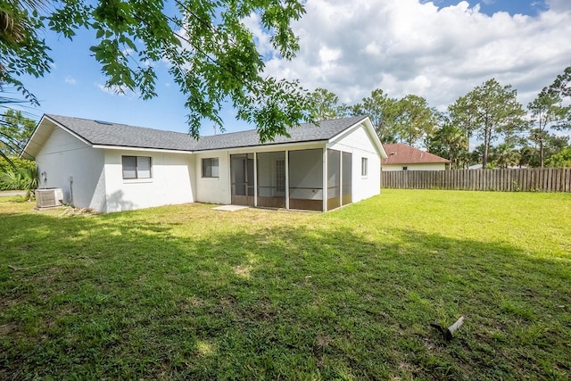 13 Whittington Dr, Palm Coast, FL 32164 - rear view of house with a sunroom