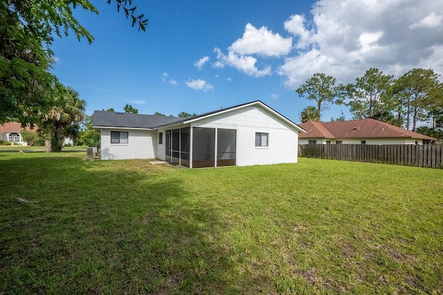13 Whittington Dr, Palm Coast, FL 32164 - rear view of property featuring a sunroom and stucco siding