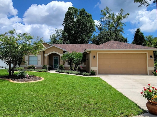 ranch-style house featuring stucco siding, concrete driveway, an attached garage, and a front lawn