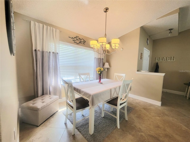 dining area with a chandelier, a textured ceiling, and baseboards