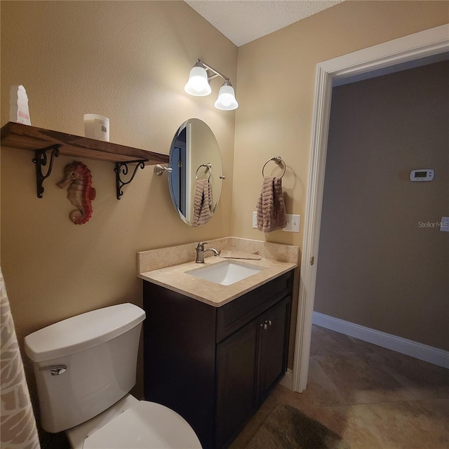 bathroom with toilet and vanity