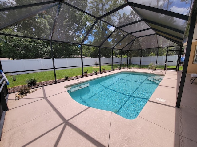 view of pool with a patio area and a lanai