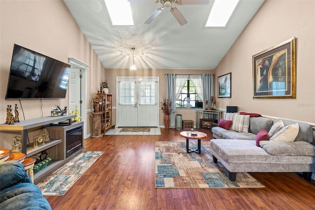 27 Black Hawk Pl, Palm Coast, FL 32137 - living room featuring a skylight, ceiling fan, wood finished floors, and high vaulted ceiling