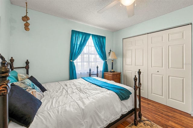 27 Black Hawk Pl, Palm Coast, FL 32137 - bedroom featuring a textured ceiling, wood finished floors, a closet, and ceiling fan