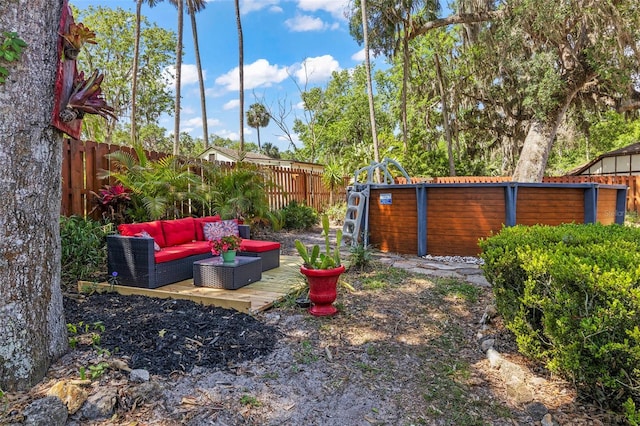 27 Black Hawk Pl, Palm Coast, FL 32137 - fenced backyard featuring an outdoor living space