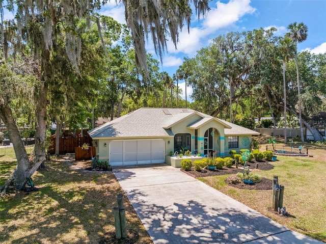 27 Black Hawk Pl, Palm Coast, FL 32137 - ranch-style home featuring an attached garage, driveway, and stucco siding