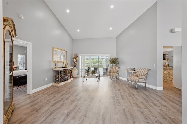 2 Cleveland Ct, Palm Coast, FL 32137 - sitting room with high vaulted ceiling, wood finished floors, attic access, and recessed lighting