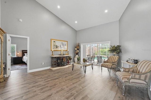 2 Cleveland Ct, Palm Coast, FL 32137 - sitting room with high vaulted ceiling, wood finished floors, and recessed lighting