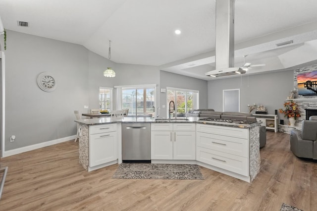 2 Cleveland Ct, Palm Coast, FL 32137 - kitchen with open floor plan, appliances with stainless steel finishes, light wood-style floors, ceiling fan, and vaulted ceiling