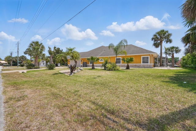 2 Cleveland Ct, Palm Coast, FL 32137 - rear view of property with a yard and stucco siding
