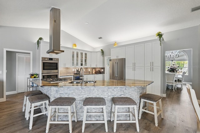 2 Cleveland Ct, Palm Coast, FL 32137 - kitchen featuring appliances with stainless steel finishes, decorative backsplash, white cabinets, glass insert cabinets, and dark wood-type flooring