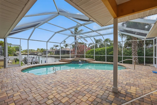 2 Cleveland Ct, Palm Coast, FL 32137 - view of pool featuring a patio, a pool with connected hot tub, a lanai, and a water view