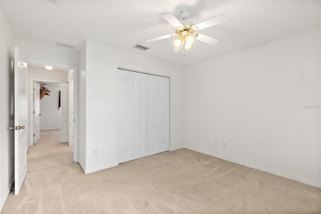 10 Eastwood Dr, Palm Coast, FL 32164 - unfurnished bedroom featuring light colored carpet, a closet, and baseboards