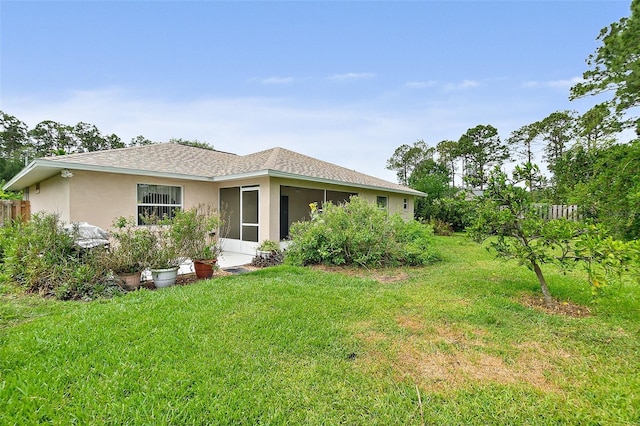 10 Eastwood Dr, Palm Coast, FL 32164 - back of house with stucco siding and a sunroom