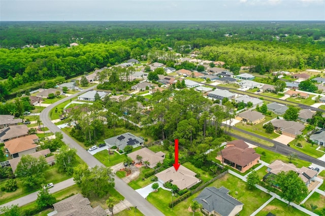 10 Eastwood Dr, Palm Coast, FL 32164 - aerial view of property and surrounding area featuring a forest and nearby suburban area