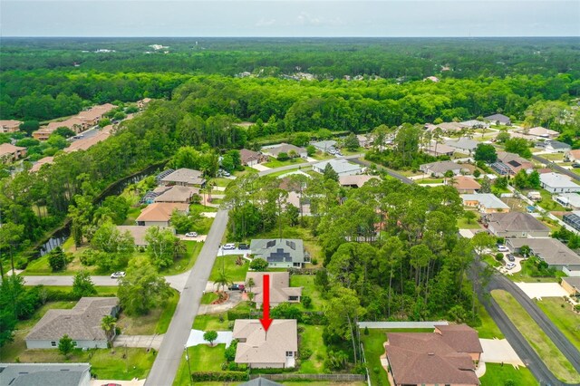 10 Eastwood Dr, Palm Coast, FL 32164 - view of property location with a forest and nearby suburban area
