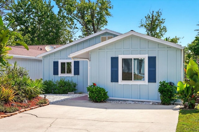 120 Oak Ln, Flagler Beach, FL 32136 - view of front of home with board and batten siding and a patio
