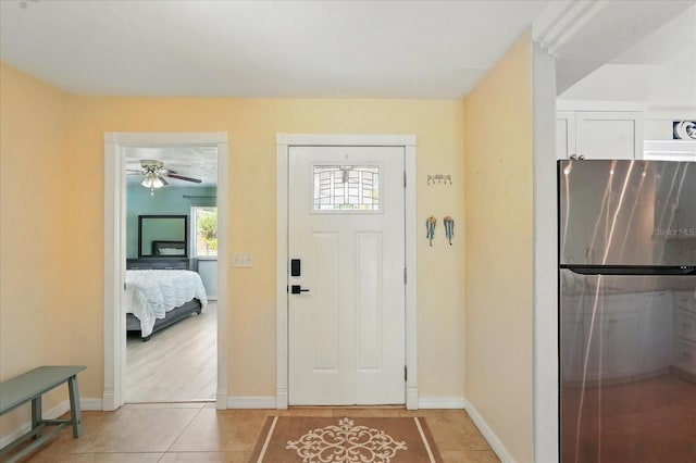 120 Oak Ln, Flagler Beach, FL 32136 - entrance foyer featuring light tile patterned floors, baseboards, and ceiling fan