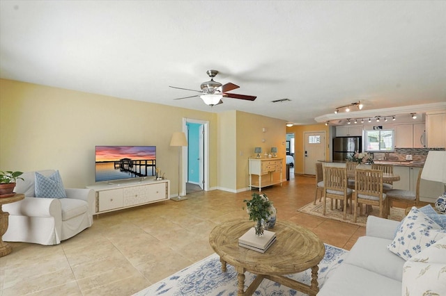 120 Oak Ln, Flagler Beach, FL 32136 - living area with light tile patterned floors and ceiling fan
