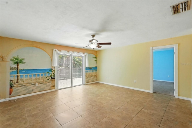 120 Oak Ln, Flagler Beach, FL 32136 - unfurnished room featuring a ceiling fan, tile patterned floors, and baseboards