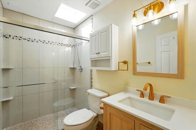 120 Oak Ln, Flagler Beach, FL 32136 - full bath with toilet, a stall shower, a skylight, and vanity