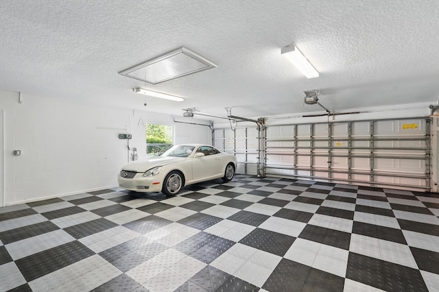 47 Old Oak Dr S, Palm Coast, FL 32137 - garage featuring a garage door opener and concrete block wall