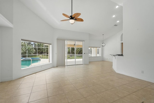 47 Old Oak Dr S, Palm Coast, FL 32137 - unfurnished living room featuring high vaulted ceiling, ceiling fan, light tile patterned flooring, recessed lighting, and baseboards