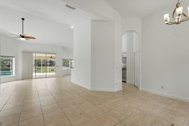 47 Old Oak Dr S, Palm Coast, FL 32137 - unfurnished room with high vaulted ceiling, light tile patterned flooring, a ceiling fan, a chandelier, and baseboards