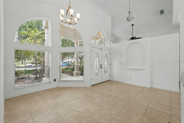 47 Old Oak Dr S, Palm Coast, FL 32137 - entrance foyer featuring a chandelier, high vaulted ceiling, tile patterned floors, ceiling fan, and baseboards