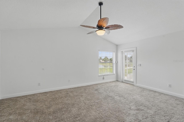 47 Old Oak Dr S, Palm Coast, FL 32137 - spare room with lofted ceiling, a ceiling fan, light carpet, and baseboards