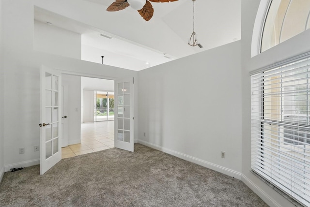 47 Old Oak Dr S, Palm Coast, FL 32137 - empty room featuring french doors, light carpet, ceiling fan, and baseboards