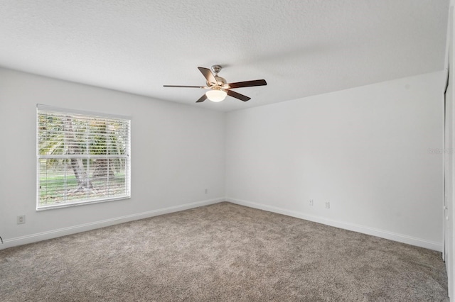 47 Old Oak Dr S, Palm Coast, FL 32137 - empty room with a ceiling fan, carpet, baseboards, and a textured ceiling