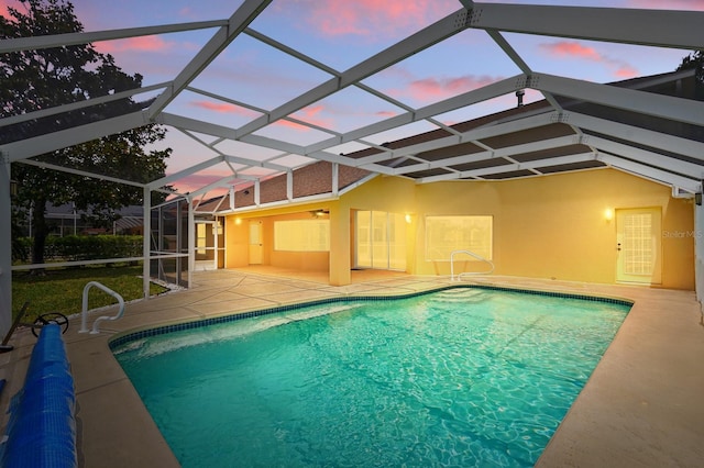 47 Old Oak Dr S, Palm Coast, FL 32137 - pool at dusk featuring a patio, an outdoor pool, and glass enclosure