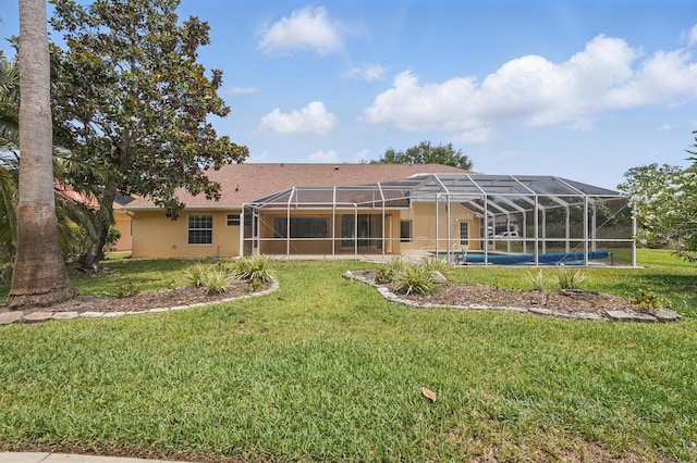 47 Old Oak Dr S, Palm Coast, FL 32137 - back of house with a lawn, stucco siding, an outdoor pool, glass enclosure, and a patio
