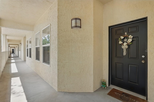 200 Bella Harbor Ct Unit 105, Palm Coast, FL 32137 - view of exterior entry with stucco siding