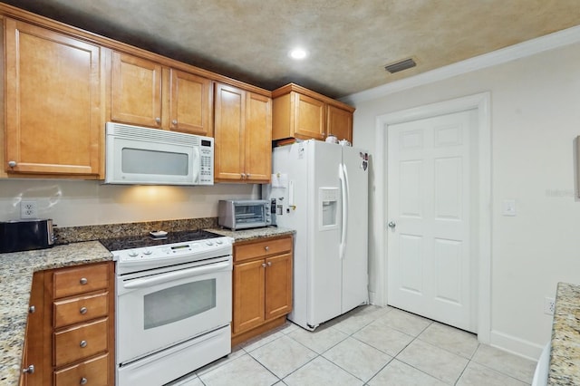 200 Bella Harbor Ct Unit 105, Palm Coast, FL 32137 - kitchen with white appliances, light tile patterned floors, brown cabinets, light stone counters, and recessed lighting