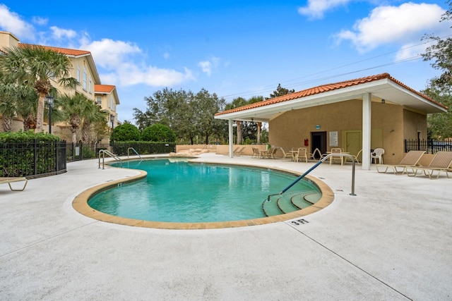 200 Bella Harbor Ct Unit 105, Palm Coast, FL 32137 - community pool with fence and a patio