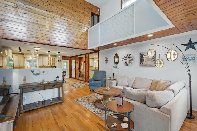 1819 S Flagler Ave, Flagler Beach, FL 32136 - living area featuring light wood-type flooring, recessed lighting, wooden walls, and a high ceiling