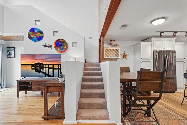 1819 S Flagler Ave, Flagler Beach, FL 32136 - stairway with wood finished floors and track lighting