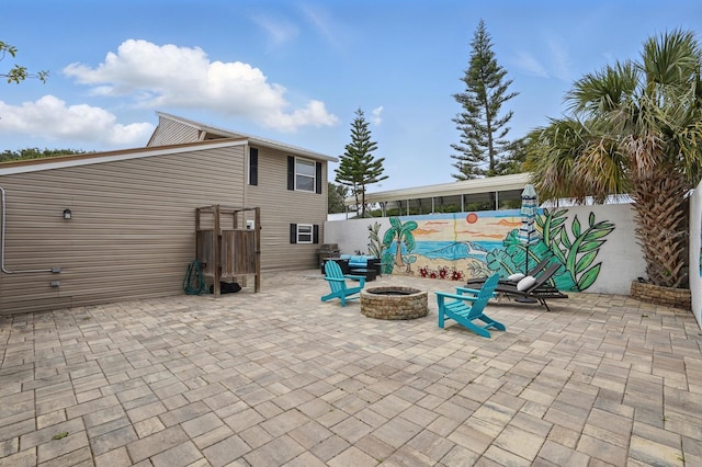 1819 S Flagler Ave, Flagler Beach, FL 32136 - view of patio / terrace featuring an outdoor fire pit and fence