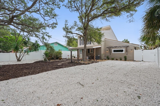 1819 S Flagler Ave, Flagler Beach, FL 32136 - view of front of home featuring a fenced backyard and a gate